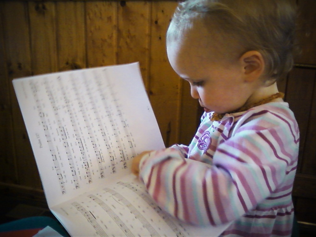 Child studying scripture music