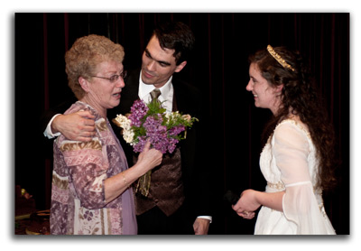 Hannah giving her bouquet to Grandy